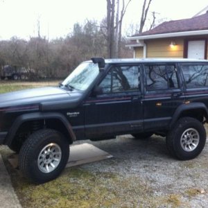 Dead 96 XJ. Made it to 230k miles! It looks clean, but has significant rust issues, like Fred Flintstone's car.